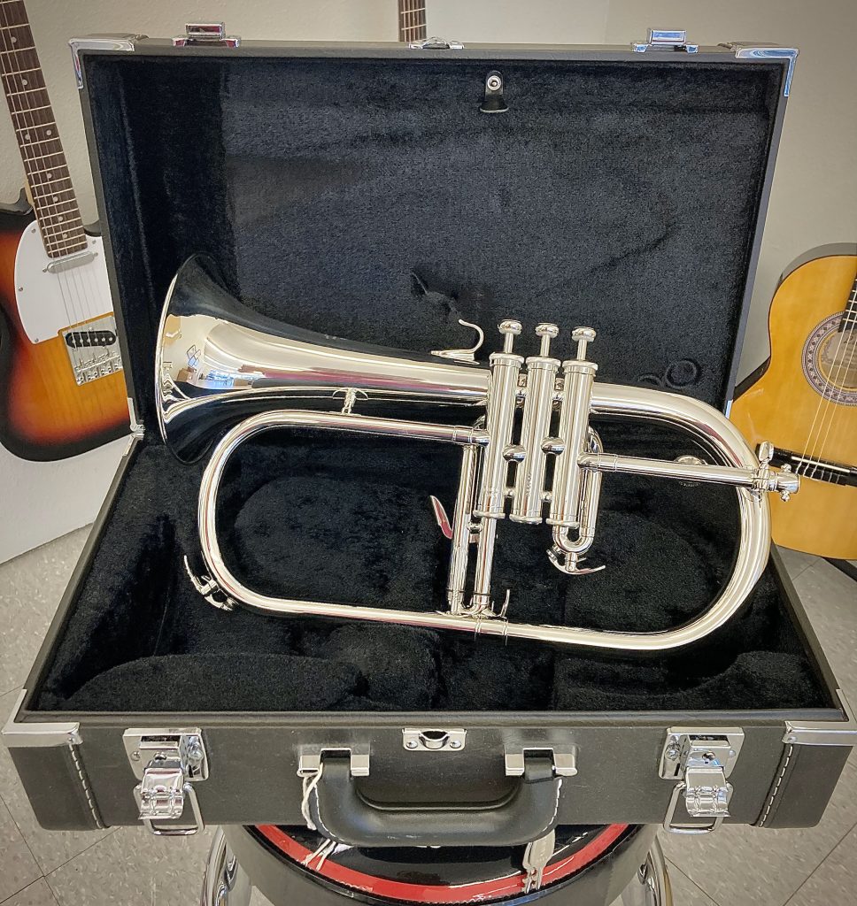 Silver flugelhorn displayed in case